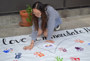 Students from Immaculate Heart High School and Middle School in Los Feliz launched Catholic Schools Week by sharing what they love about their school — and their handprints — on a giant poster created by the high school's Associated Student Body and Ministry Team. Among the many inscriptions, 