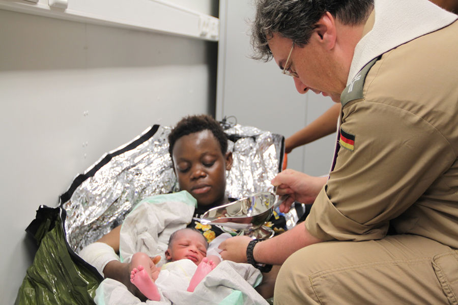 Baptism at sea - refugee child born during boat rescue Angelus News.
