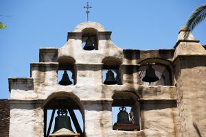 The altar, along with the mission’s bell tower and museum were spared, but the thick adobe walls were blackened. (Victor Alemán/Angelus News)