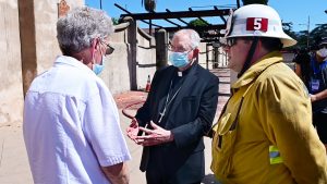 Archbishop José H. Gomez talks with Mission San Gabriel pastor Fr. John Molyneux, CMF .and San Gabriel Fire Chief Steve Wallace hours after the July 11, 2020 fire at Mission San Gabriel. (John McCoy/Angelus News)
