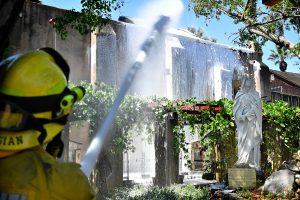 Firefighters at the scene of the fire at San Gabriel Mission the morning of Saturday, July 11. (John McCoy/Angelus)