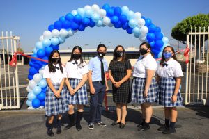 Eighth-grade teacher Stacy Acuna with students from St. Joseph School in La Puente at an Aug. 28 back-to-school ceremony and blessing for the school’s newly renovated K-8 building. 
(DAVID AMADOR RIVERA)