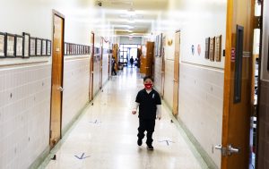 Arrows help students travel through the hallways at a social distance at Holy Name of Mary.  (Victor Alemán)