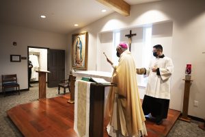 Archbishop Gomez blesses the new altar in the Queen of Angels Center chapel. (Victor Alemán)