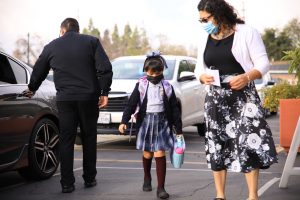 A student arrives at St. Bernard School for in-person learning. (David Amador Rivera)