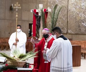 Archbishop Gomez blesses palms at Palm Sunday Mass at the Cathedral of Our Lady of the Angels. (Victor Alemán)