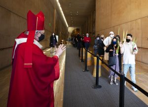 Archbishop Gomez greets Massgoers after Palm Sunday Mass at the exit of the cathedral. (Victor Alemán)