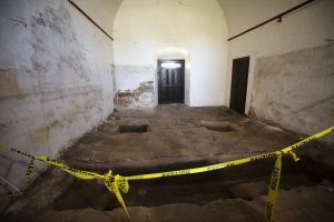 The more than 150,000 gallons of water used to put out the fire last July caused the floor of the mission’s sacristy to sink, revealing layers of stone and brick used to first build the church. No human remains have been found in excavations since the fire. (Victor Alemán)
