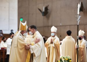 Archbishop Gomez greets new LA priest Father Andrew Hedstrom at his ordination Mass on June 8, 2021. (Victor Alemán)