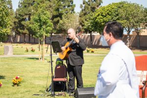 A musician performs at the Santa Clara Cemetery section dedication. (JohnMichael Filippone)