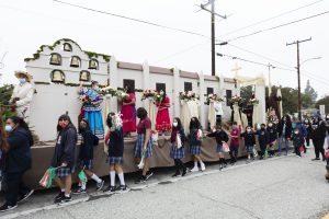 Students from Epiphany School in El Monte with their parish’s float, which won the contest’s first place $3,000 award. (Victor Alemán)