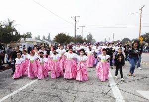 Junior members of the Ballet Folklorico from Resurrection Church in Boyle Heights process through the streets of East LA. (Victor Alemán)