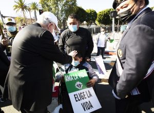 Archbishop Gomez blesses an LA Catholic at the 2022 OneLife LA event. (Victor Alemán)