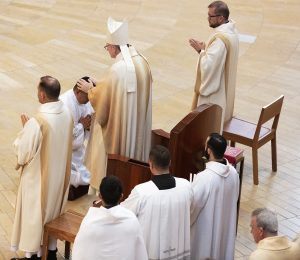 Bishop Barron blesses a newly ordained deacon. (Victor Alemán)
