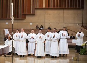 The eight transitional deacons at the Cathedral of Our Lady of the Angels before their ordination. (Victor Alemán)