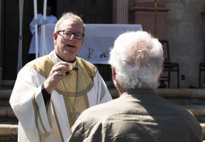 Bishop Barron distributes communion at his installation Mass on July 29. (Diocese of Winona-Rochester)