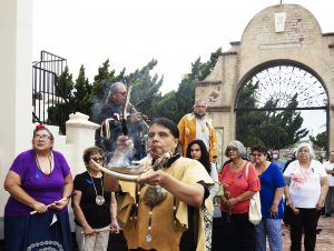 Before the closing of the jubilee Holy Door, members of the Gabrieleño San Gabriel Band of Mission Indians honored their ancestors who built the mission and are buried on its grounds with songs of healing and remembrance. (Isabel Cacho)
