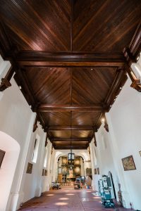 The mission's restoration team was so impressed by the color of the redwood beams in the mission's new ceiling that they decided not to paint over the wood. (Simon Kim)