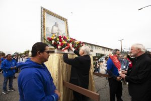 Archbishop Gomez places flowers before the image of St. Juan Diego at the 91st annual procession for Our Lady of Guadalupe Dec. 4, 2022. (Victor Alemán)