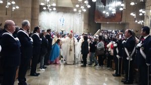 Archbishop Jose H. Gomez blesses a woman at the end of the Dec. 15 Simbang Gabi opening Mass at the Cathedral of Our Lady of the Angels. (Victor Alemán)