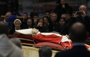 People pay their respects at the body of Pope Benedict XVI in St. Peter's Basilica at the Vatican Jan. 3, 2023. (CNS photo/Paul Haring)