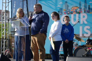 Mike and Penny Michalak and two of their children speak at OneLife LA Jan. 21, 2023. (Stefano Garzia)