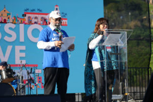 Mental health advocates Rick and Modesta Pulido share their testimony on the OneLife LA event stage Jan. 21, 2023. (Stefano Garzia)