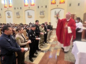 Parents who serve in the military and as first responders received a special blessing at All Souls World Language Catholic School in Alhambra on Friday, Feb. 2. (Submitted photo)