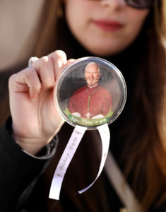 Mourners at Bishop David O’Connell’s March 3 funeral wore pins with his episcopal motto “Jesus, I trust in you” at the March 3 funeral Mass. (Jay L. Clendenin/LA Times)