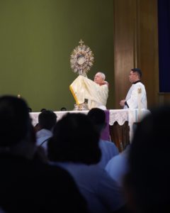 Los Angeles Archbishop José H. Gomez holds the Blessed Sacrament during Mass at Mission San Gabriel Arcángel. (Archdiocese of Los Angeles/Digital Team)