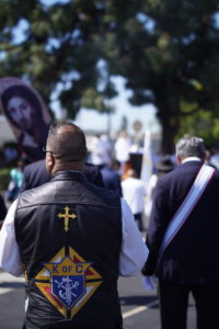 A man wearing a Knights of Columbus vest participates in the eucharistic procession that went from Mission San Gabriel Arcángel to St. Luke the Evangelist Church in Temple City, then back to the mission. (Archdiocese of Los Angeles/Digital Team)