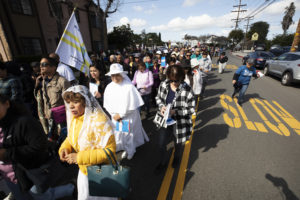 Hundreds of parishioners walk with Los Angeles Archbishop José H. Gomez and the Blessed Sacrament during the 6-mile eucharistic procession that went from Mission San Gabriel Arcángel to St. Luke the Evangelist Church in Temple City, then back to the mission. (Victor Alemán)