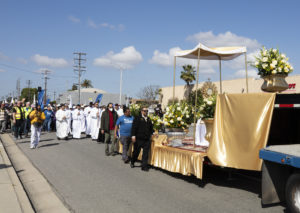 Hundreds of parishioners walk behind the Blessed Sacrament during the 6-mile eucharistic procession that went from Mission San Gabriel Arcángel to St. Luke the Evangelist Church in Temple City, then back to the mission. (Victor Alemán)