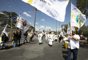 Local members of the Nocturnal Adoration Society walked at the front of the eucharistic procession that went from Mission San Gabriel Arcángel to St. Luke the Evangelist Church in Temple City, then back to the mission. (Victor Alemán)