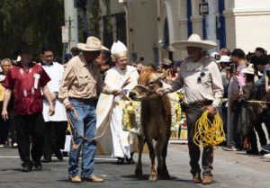 Archbishop José H. Gomez processes to Olvera Street in downtown LA for the annual “Blessing of the Animals” on Holy Saturday. (Victor Alemán)
