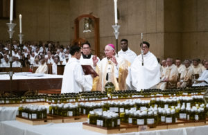 Archbishop José H. Gomez blesses the chrism oil during the annual chrism Mass on Monday, April 3. Some 400 priests from around the archdiocese attended. (Victor Alemán) 