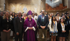 Archbishop Jóse H. Gomez poses with all the teachers and students honored at the annual Christian Service Awards Mass at the Cathedral of Our Lady of the Angels March 25. (Victor Alemán)