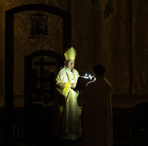 Archbishop José H. Gomez presides over the Easter Vigil Mass in darkness before the lighting of the Paschal Candle. (Victor Alemán)