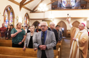 Archbishop José H. Gomez sprinkles holy water over the congregation celebrating Mass at St. Anthony Croatian Church on April 16. The bilingual Mass in English and Croatian was also part of Mladifest, which hosted Croatian Catholic youth from all over North America. (Victor Alemán)