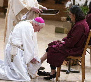 Archbishop José H. Gomez washes the feet of people who participated in the ritual washing of the feet during the Mass of the Lord’s Supper on Holy Thursday, April 6. (Victor Alemán)