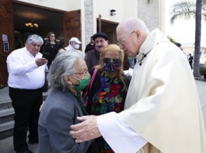 Msgr. John Moretta, pastor of Resurrection Church in Boyle Heights, gathers with well-wishers after a special Mass on April 30 celebrating 55 years since his ordination to the priesthood and 40 years at Resurrection. (Victor Alemán)