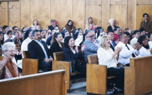 Parishioners at Resurrection Church in Boyle Heights applaud for Msgr. John Moretta during a special Mass on April 30 celebrating 55 years since his ordination to the priesthood and 40 years at Resurrection. (Victor Alemán)