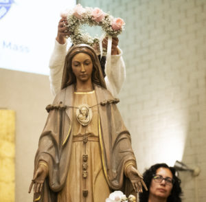 The statue of the Blessed Virgin Mary at St. Dorothy in Glendora gets crowned during a May 5 May Crowning Mass. (Victor Alemán)