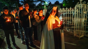 A Carmelite sister leads the candlelight procession during the Carmelite Sisters of the Most Sacred Heart of Los Angeles' special Mass event in response to the Dodgers' decision to honor the Sisters of Perpetual Indulgence on Friday, June 16. (John Rueda/ADLA)