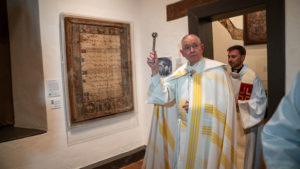 Archbishop José H. Gomez blesses the new exhibit highlighting the history of the reopened Mission San Gabriel Arcángel. (John Rueda/ADLA)