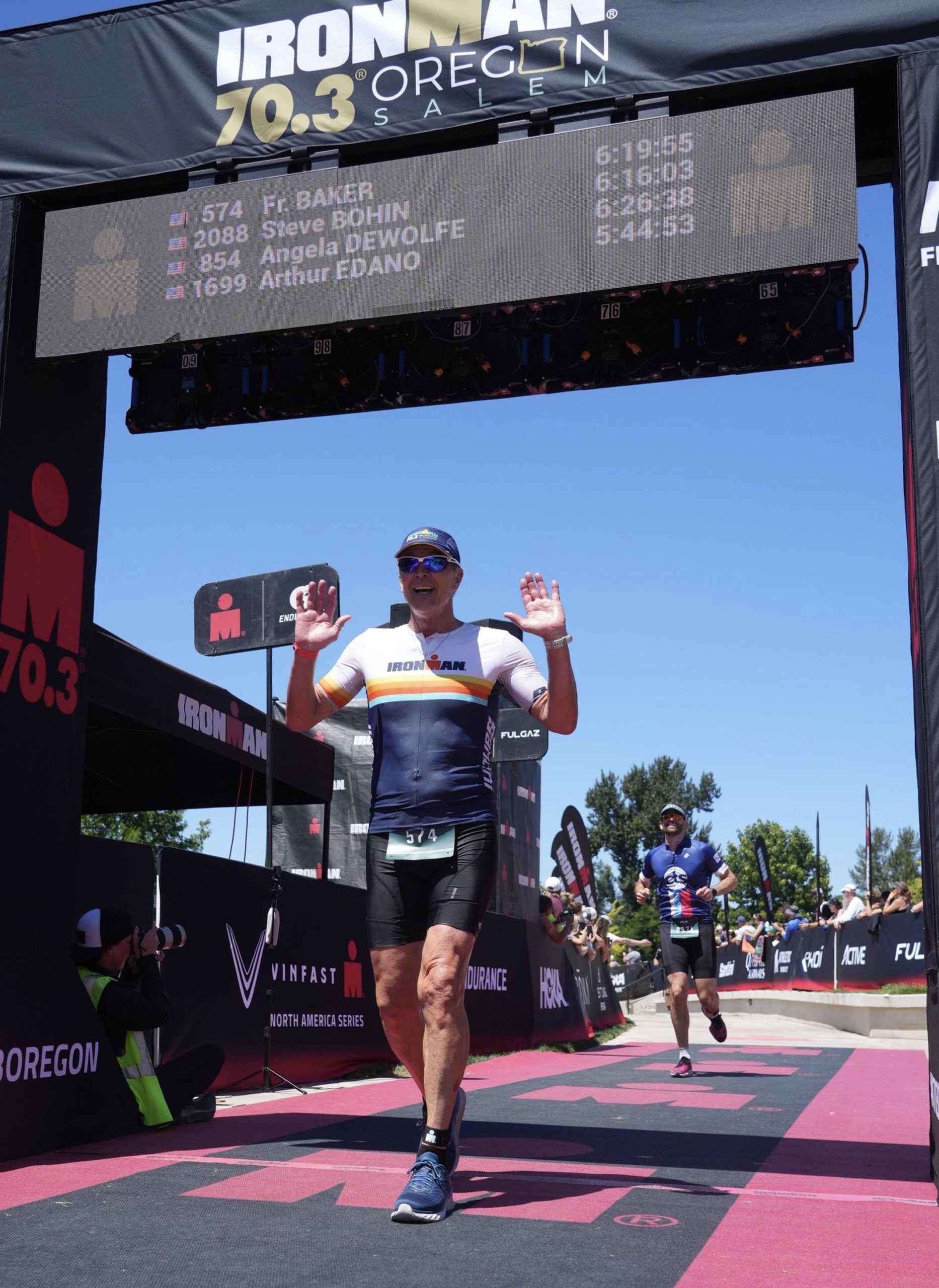 Father Tom Baker is still doing triathlons at age 64