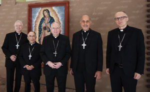 Los Angeles Archbishop José H. Gomez, center, poses with new LA auxiliary bishops appointed by Pope Francis prior to their press conference announcement on July 18 (left to right): Father Matthew Elshoff OFM, Cap., Father Brian Nunes, Msgr. Albert Bahhuth, and Father Slawomir Szkredka. (Victor Alemán)