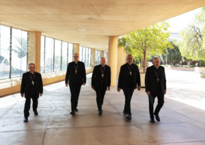 Father Matthew Elshoff OFM, Cap., Father Brian Nunes, Msgr. Albert Bahhuth, and Father Slawomir Szkredka walk with Archbishop José H. Gomez at Cathedral of Our Lady of the Angels' outdoor plaza prior to a press conference announcing the four LA priests as new auxiliary bishops. (Victor Alemán)