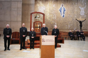 Los Angeles Archbishop José H. Gomez, left, stands with new LA auxiliary bishops appointed by Pope Francis during their press conference announcement (left to right): Msgr. Albert Bahhuth, Father Brian Nunes, Father Slawomir Szkredka, and Father Matthew Elshoff OFM, Cap. (Victor Alemán)