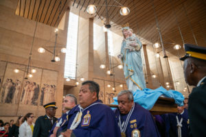 A statue of the Virgin Mary and baby Jesus is carried in during the special “One Mother, Many Peoples” Mass at the Cathedral of Our Lady of the Angels on Aug. 26. (John Rueda/ADLA)